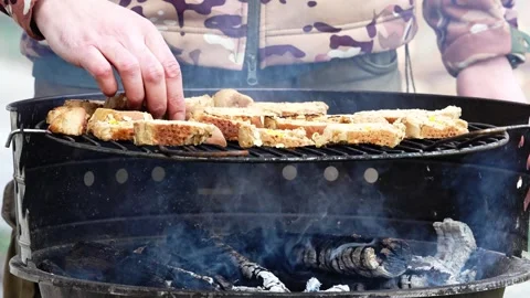 Grilling Bread Flatbreads On Charcoal Barbecue Grill Turning Bread On Hot BBQ Stock Footage 330950150