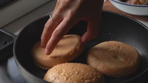 Grilling bread on hot pan for make burgers. Stock Footage 120250298