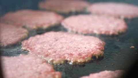 Grilling burger meat on a grill Stock Footage 256079309
