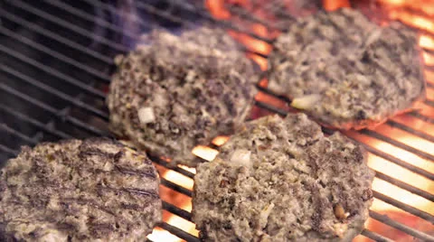 Grilling burgers Stock Footage 24706896