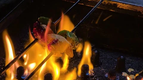 Grilling Capsicum, Onion, and Pineapple on Skewers in a Tandoor in Agra, India. Stock Footage 266430526