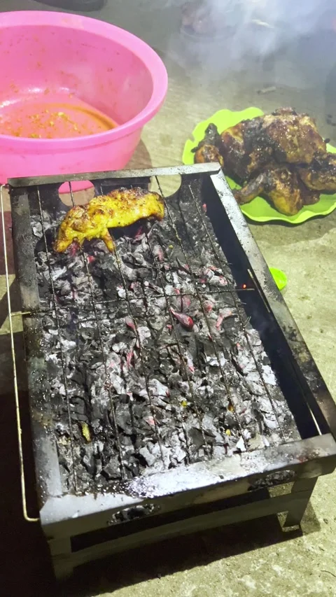 Grilling Chicken on a Barbecue Grill Video stock 332334735