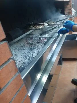 The grilling chicken in the barbeque Stock Photos