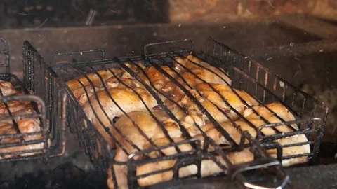 Grilling Chicken on BBQ. Chicken on the grill. Chicken meat cooking on bbq grill Stock Footage 89955748