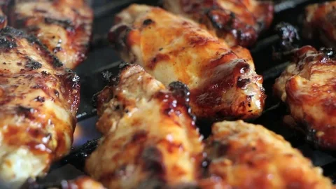 Grilling Chicken Drumsticks on BBQ Stock Footage