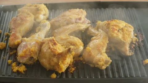 Grilling chicken Stock Footage 169036844