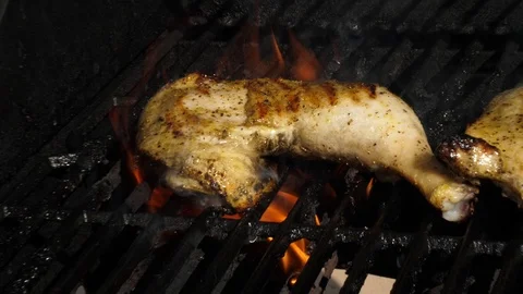 Grilling Chicken Lemon Pepper with Flames Zoom Slow Motion Close Up Stock Footage 78497084