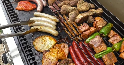 Grilling Chicken Meat Close Up hot Barbecue grill season family enjoy Video stock 336575863
