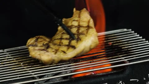 Grilling Chicken over Charcoal Fire Stock Footage 334280568