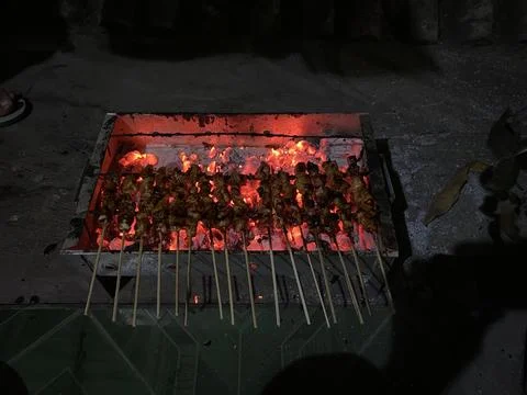 Grilling chicken satay Stock Photos