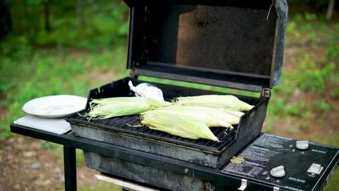 Grilling Corn on the Cob 2 Stock Photos