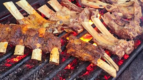 Grilling the delicious barbeque beef ribs glazed with sticky spicy sauce on.. Stock Footage 281948359