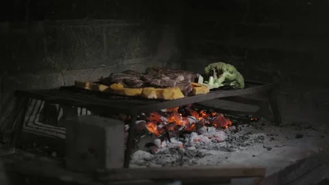 Grilling Different Types of Meat on a Traditional Barbecue along with Vegetables Video stock 296515605