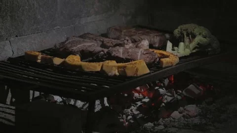 Grilling Different Types of Meat on a Traditional Barbecue along with Vegetables Stock Footage 296515630