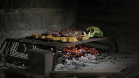 Grilling Different Types of Meat on a Traditional Barbecue along with Vegetables Stock Footage 296515631