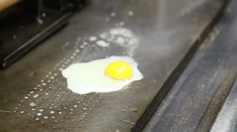 Grilling an Egg 1080p HD.mp4 Stock Footage 53624431