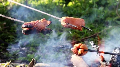 Grilling of fatty sausages. Video stock 75149887