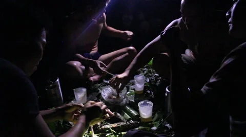 Grilling fish on campfire Stock Footage 52375814