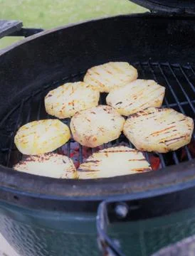 Grilling fresh pineapple Stock Photos