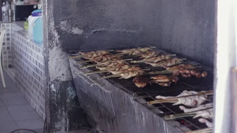 Grilling Gai Yang, Thai BBQ Chicken, At Thailand Street Food Restaurant Stock Footage 237587610