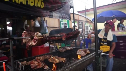 Grilling a goat Stock Footage 276587028