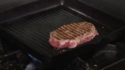 Grilling hamburger on the grill Stock Footage 70567968