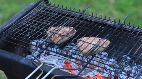 Grilling hamburgers Stock Footage 53010774