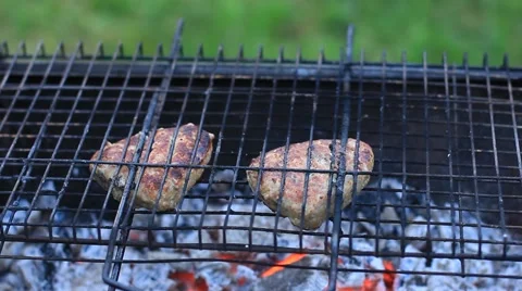 Grilling hamburgers Stock Footage 53010791