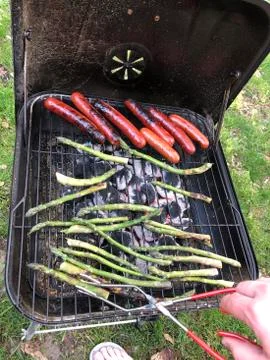 Grilling Hot Dogs and Asparagus Stock Photos