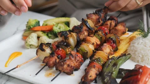 Grilling kebabs with vegetables at outdoor kitchen Stock Footage 330147551