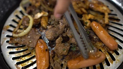 Grilling Korean barbeque Stock Footage 211791683