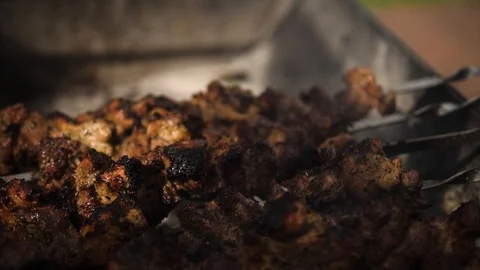 Grilling Marinated Shashlik skewered meat on a Grill BBQ. Beef prepared on fire 스톡 동영상 112730853
