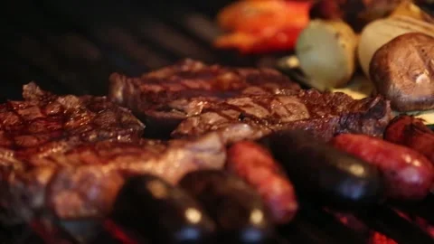 	grilling meat and raw vegetables in a barbecue Stock Footage 131987387