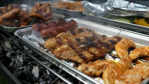 Grilling Meat and Vegetables on BBQ Video stock 81018599