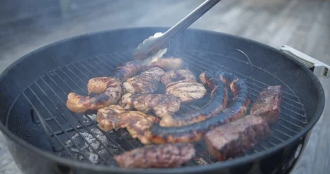 Grilling Meat on Barbecue Stockbeeldmateriaal 111884770