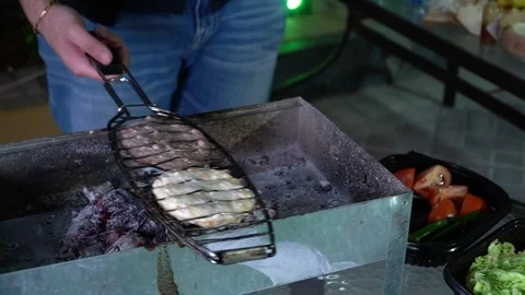 Grilling meat on barbecue Stock Footage 319948995