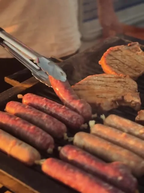 Grilling Meat Chops and Sausages on a Hot Barbecue Grill Stock-Footage 342263883