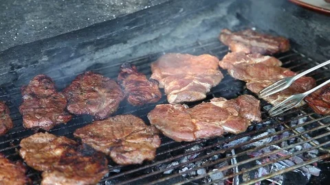 Grilling meat Stock Footage 100990652