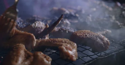 Grilling Meat at Night Close Up Stock Footage 147129368
