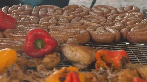 Grilling meat over burning coals. grilled vegetables. close-up. Grilling food Stock Footage 252426677