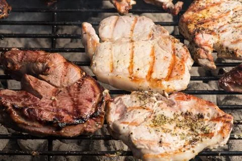 Grilling meats Stock Photos