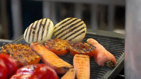 Grilling Mixed Vegetables on a Hot Griddle in a Professional Kitchen Stock Footage 321367077