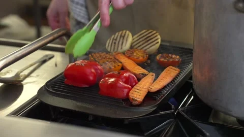 Grilling Mixed Vegetables on a Hot Griddle in a Professional Kitchen Stock-Footage 321367133