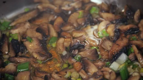 Grilling mushrooms in the pan Stock Footage 153996765