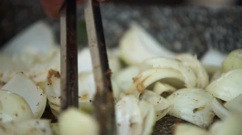 Grilling onions in a pan Stock Footage 54171927