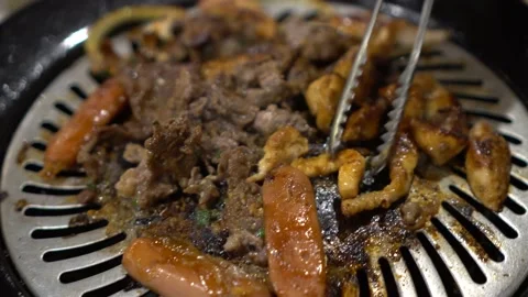 Grilling process of Korean barbeque Stock Footage 211791684
