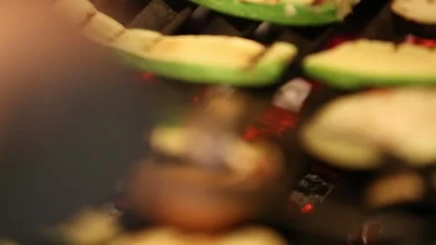 Grilling raw meat and vegetables in a barbecue Stock Footage 131986883