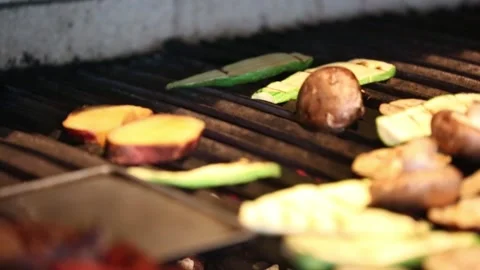 Grilling raw vegetables in a barbecue Stock Footage 131987287