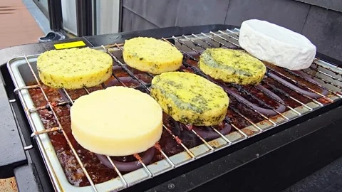 Grilling Round Cheese Slices and Polenta on Electric BBQ Grill Stock-Footage 344703933