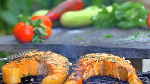 Grilling salmon with fresh spices Stock Footage 121089134